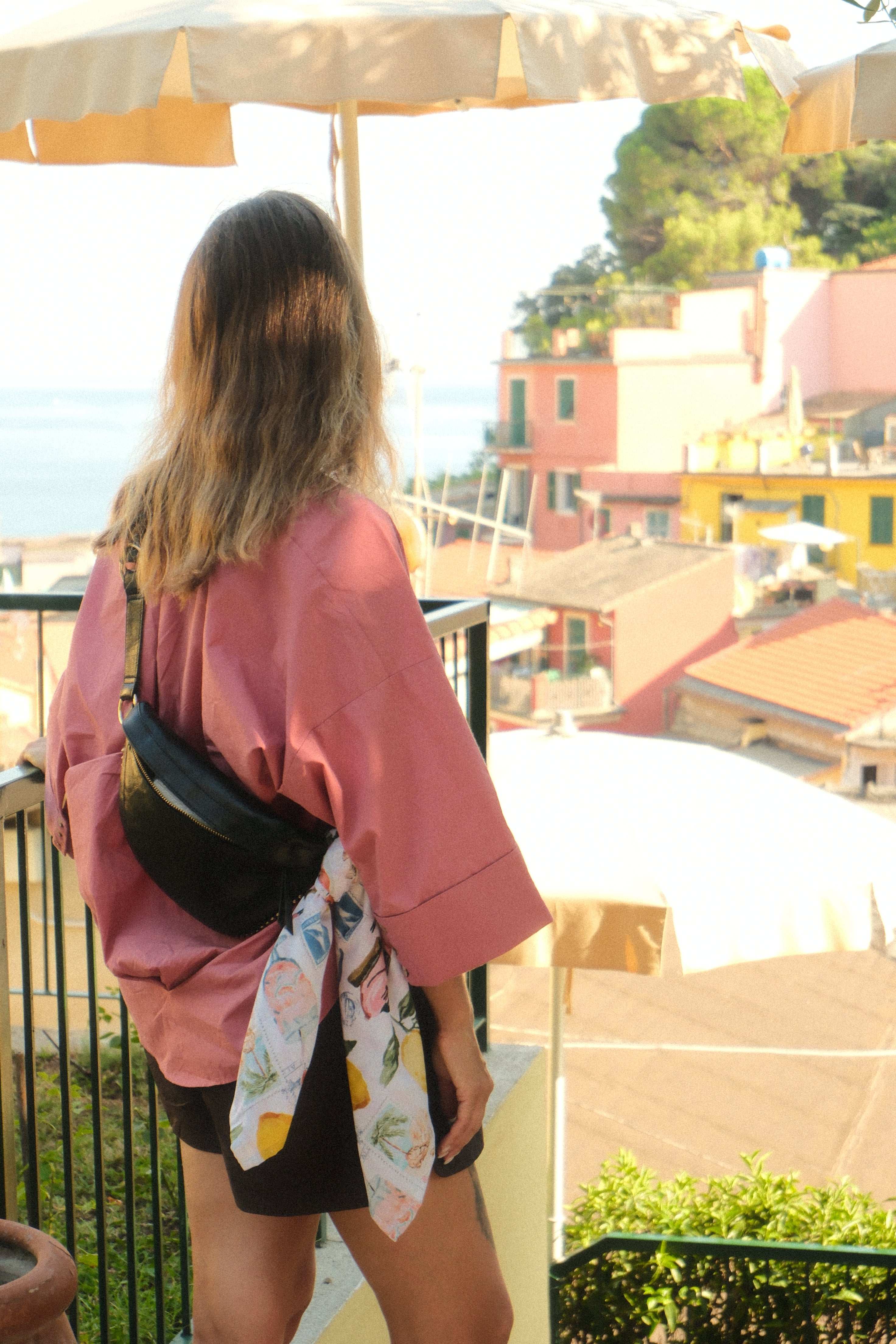 Person holding a colorful bag with a blurred background
