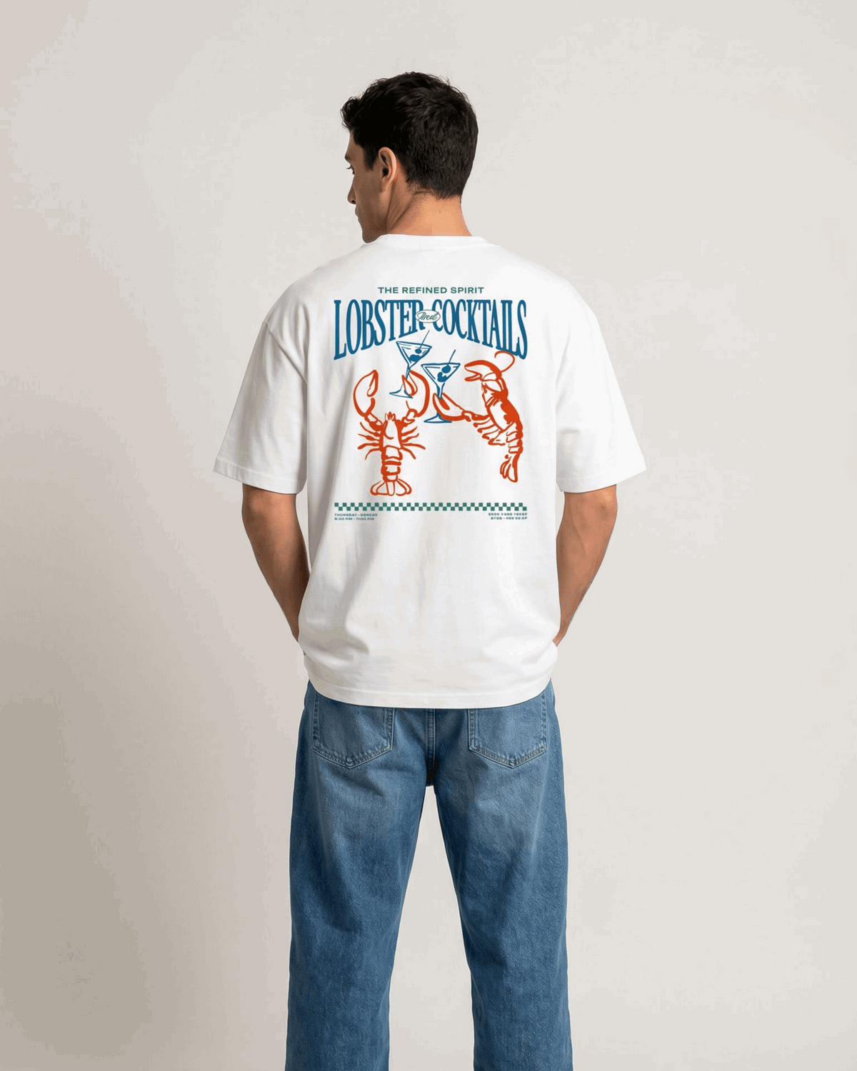 Person wearing a white t-shirt with colorful graphics and text on the back, standing against a plain background.