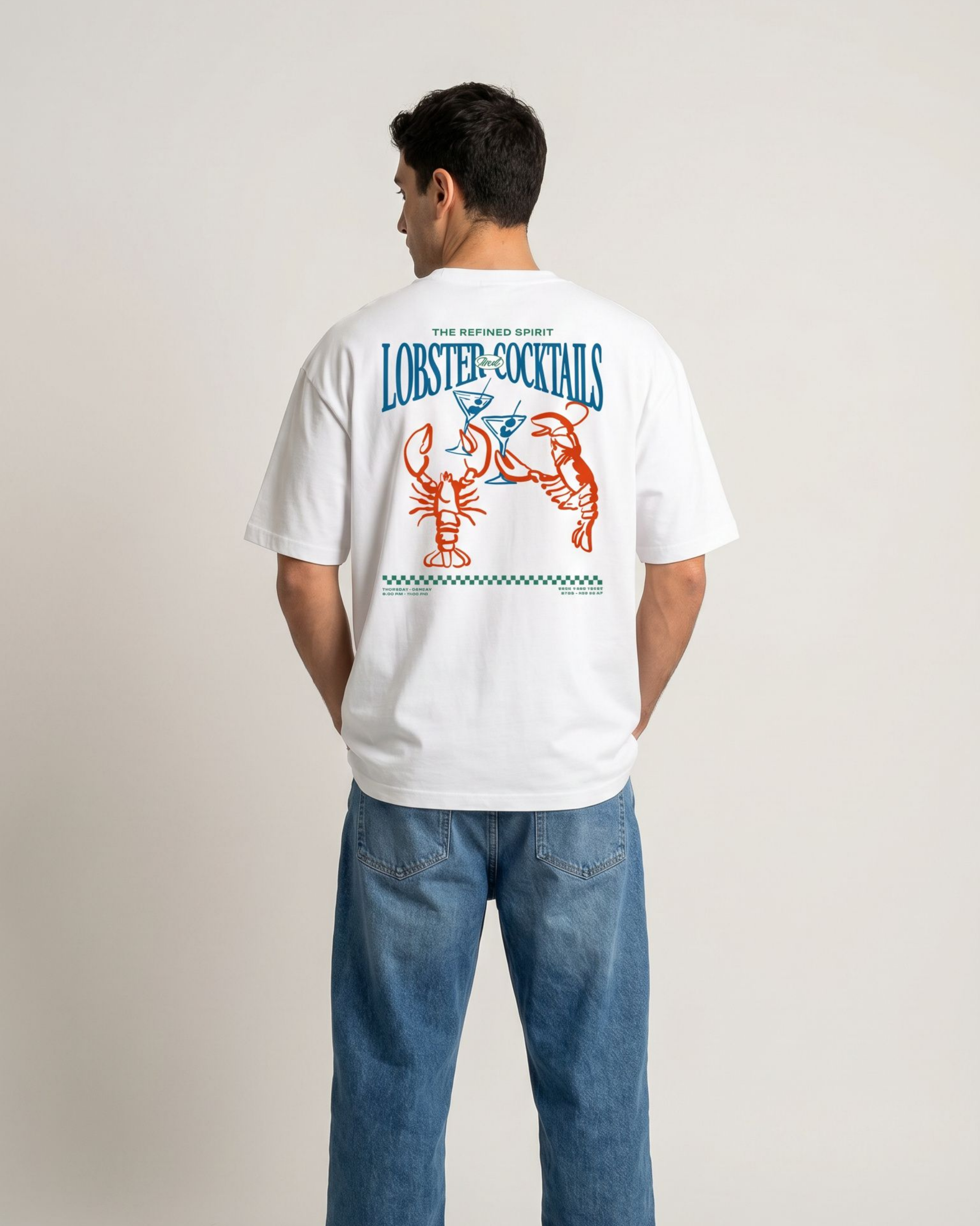 Person wearing a white t-shirt with colorful graphics and text on the back, standing against a plain background.