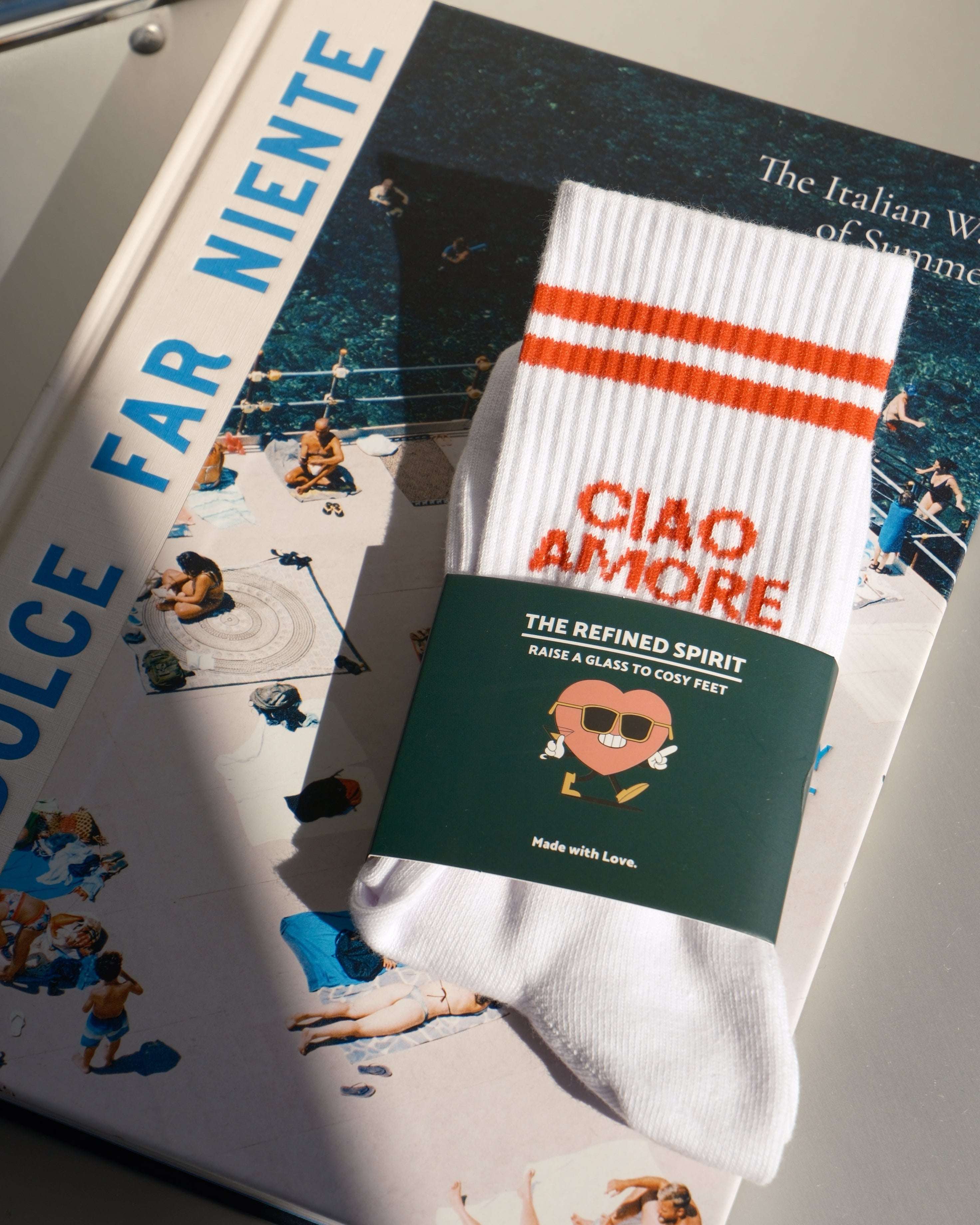 Product display with a card and ribbon on a magazine or book