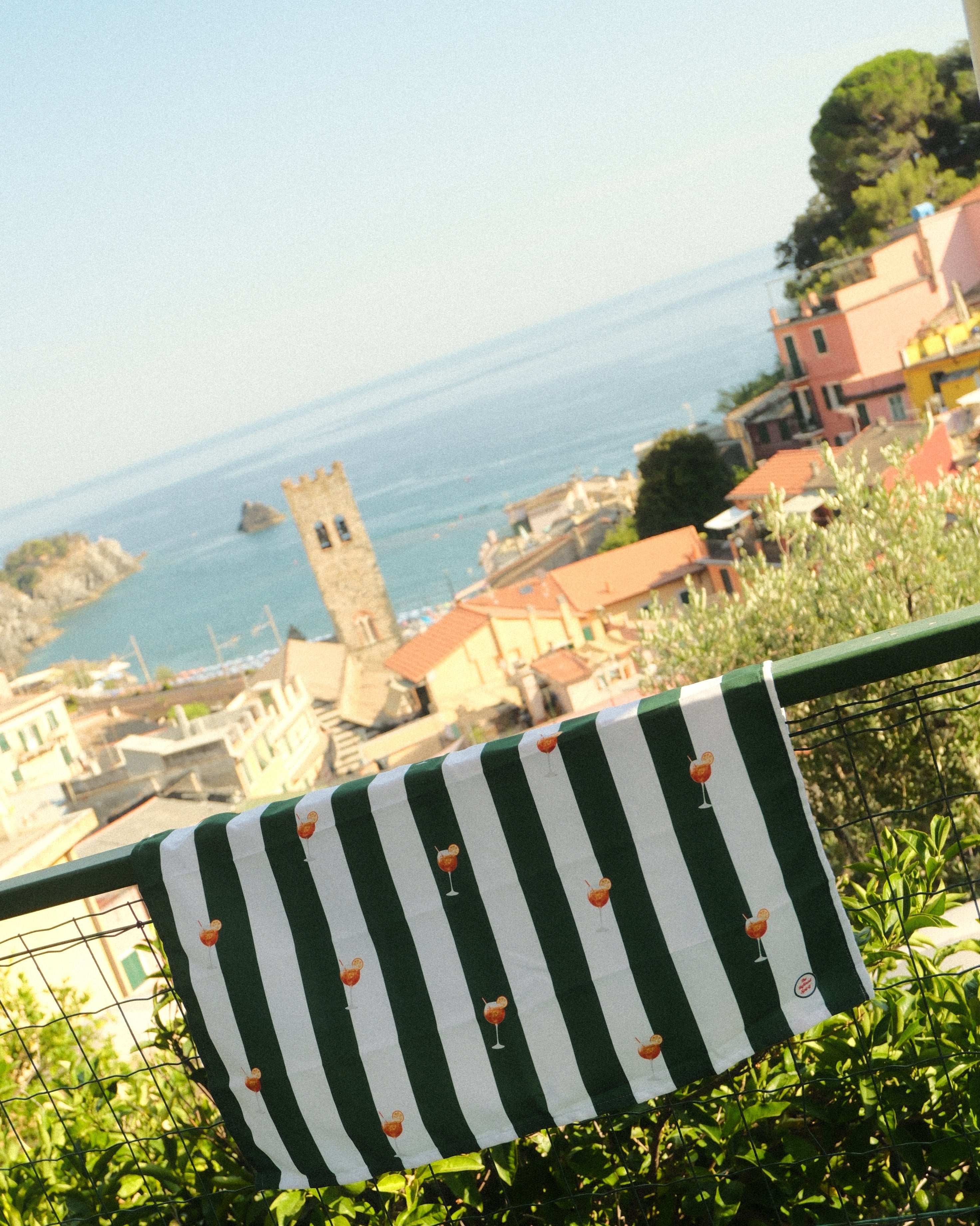 Striped fabric with a scenic background of buildings and water