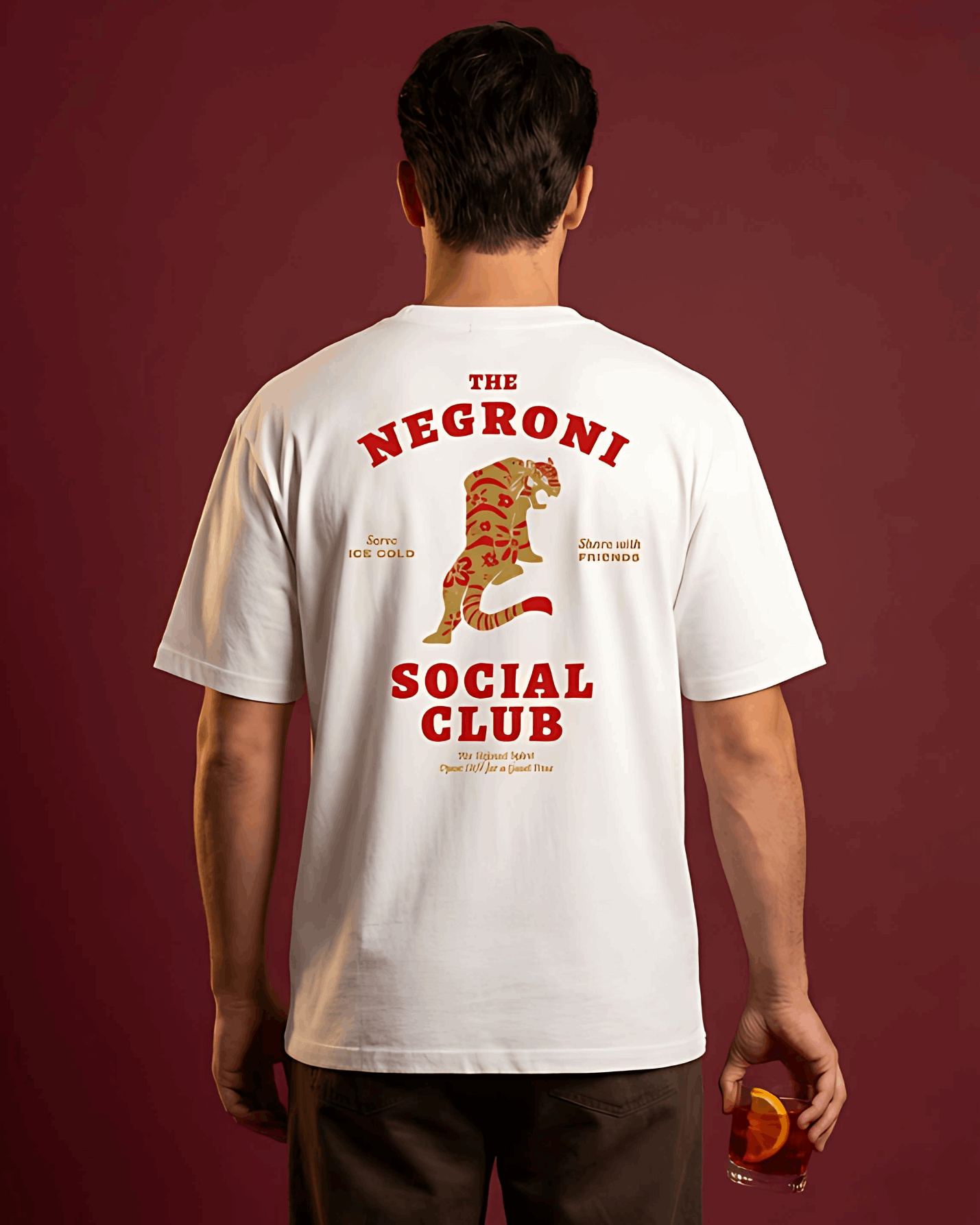Person wearing a white t-shirt with 'The Negroni Social Club' design on the back against a red background