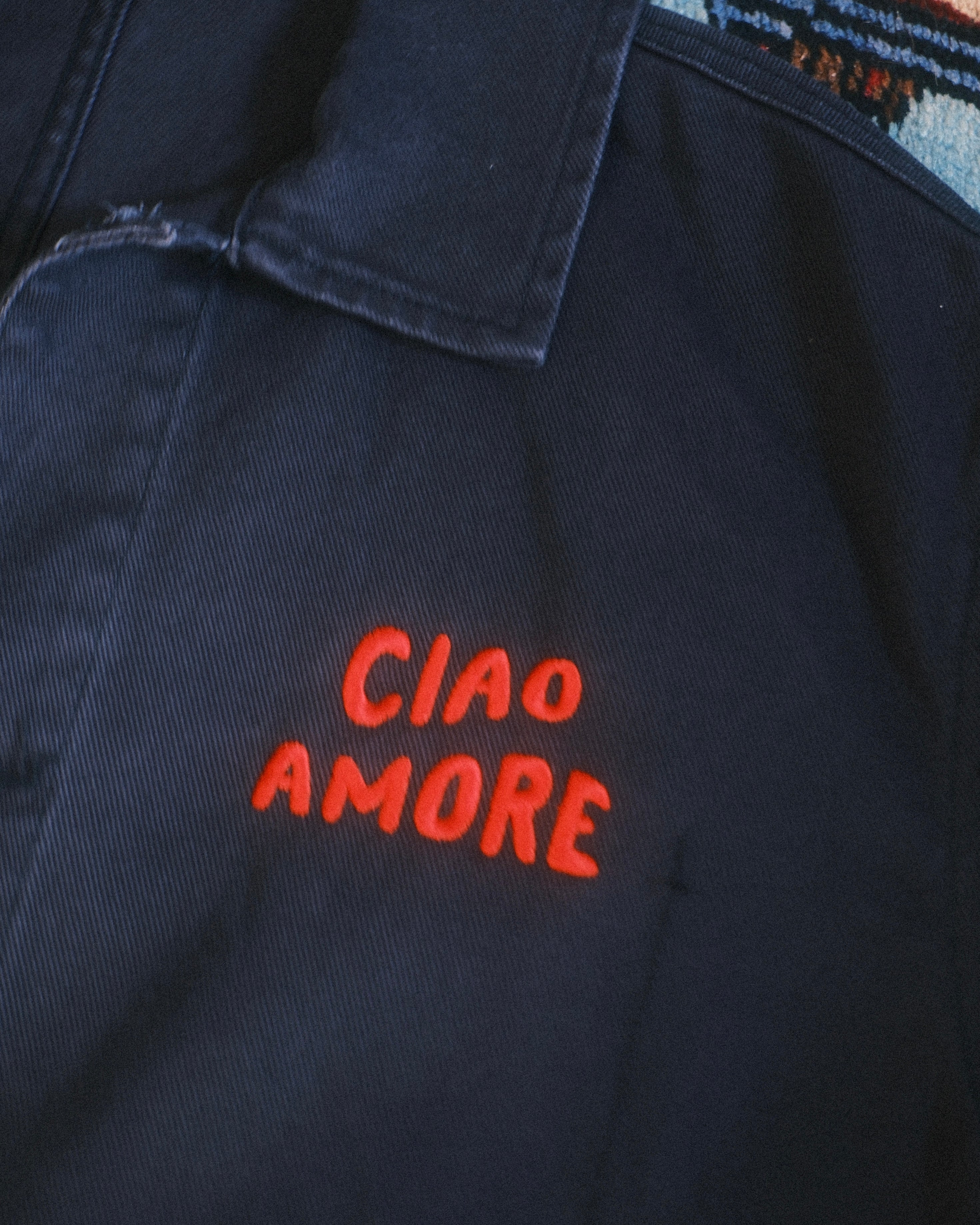 Navy blue shirt with 'CIAO AMORE' text in red on a textured background