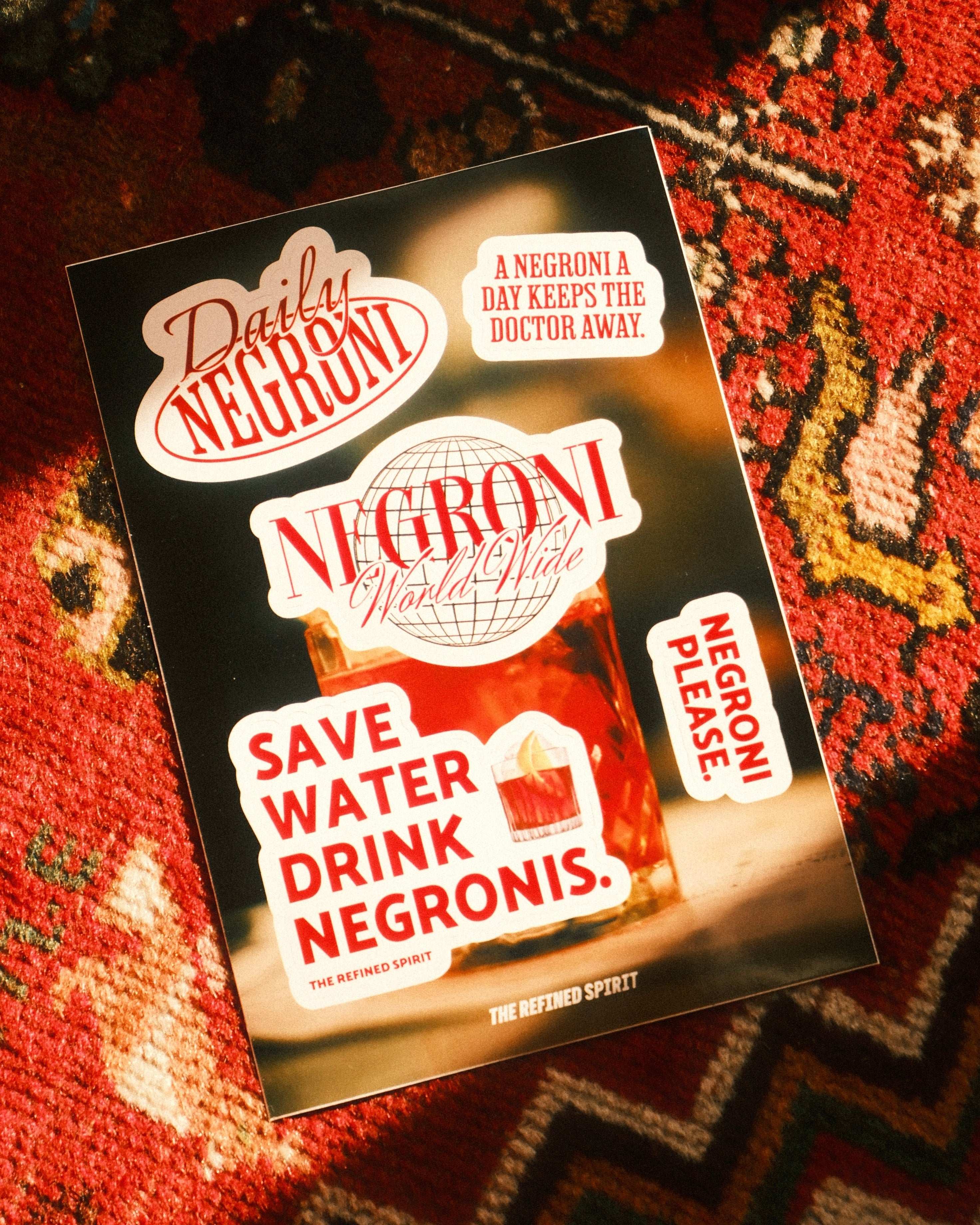 Negroni-themed card with text on a patterned surface