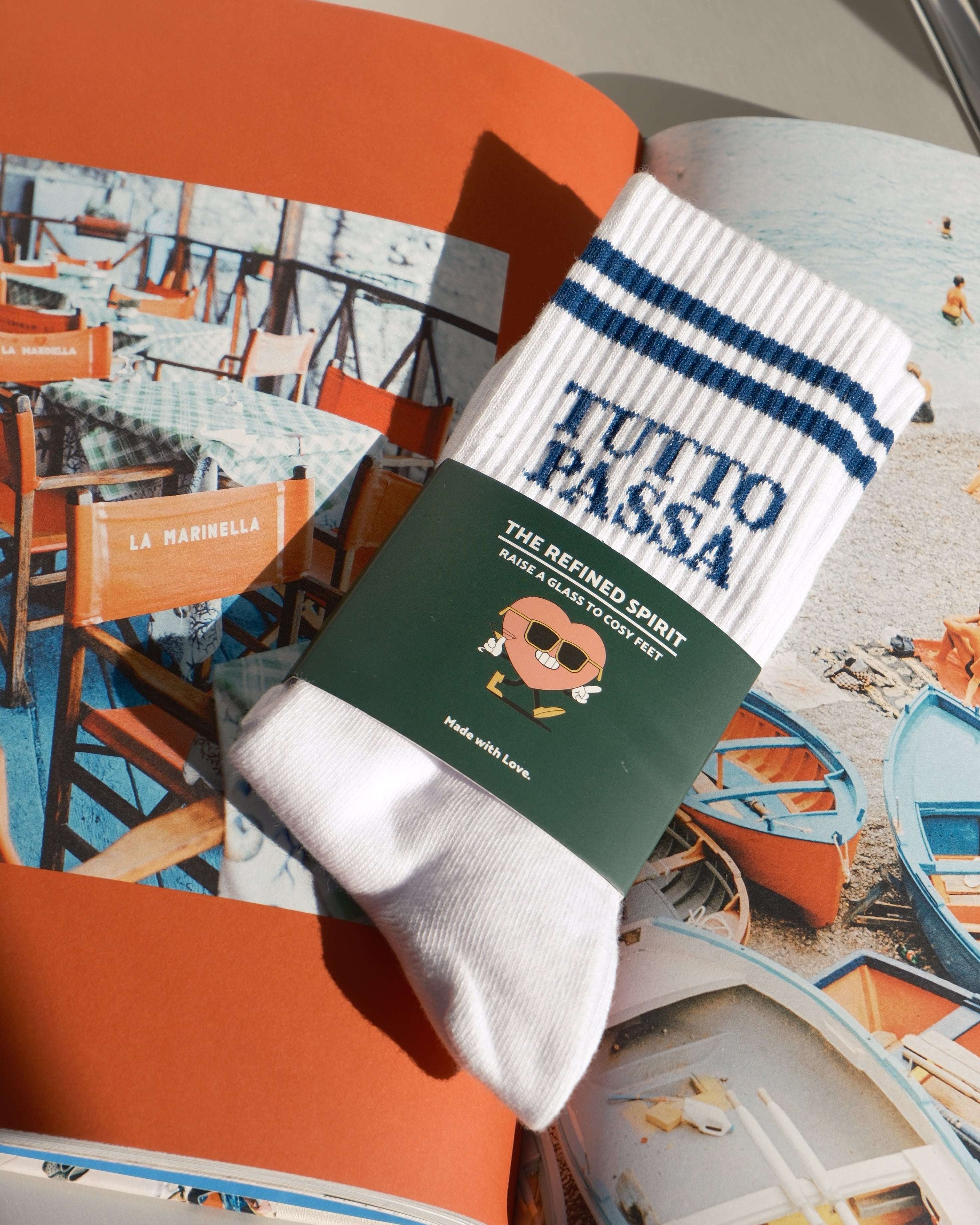 Pair of socks with a green label on an orange surface